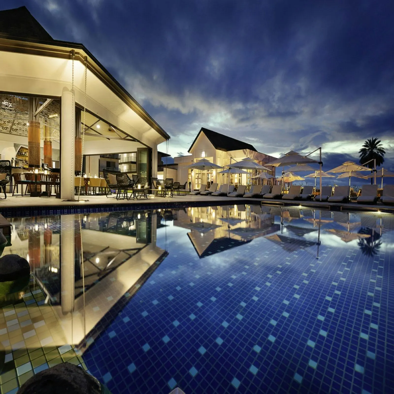 Adults-only resort pool at dusk